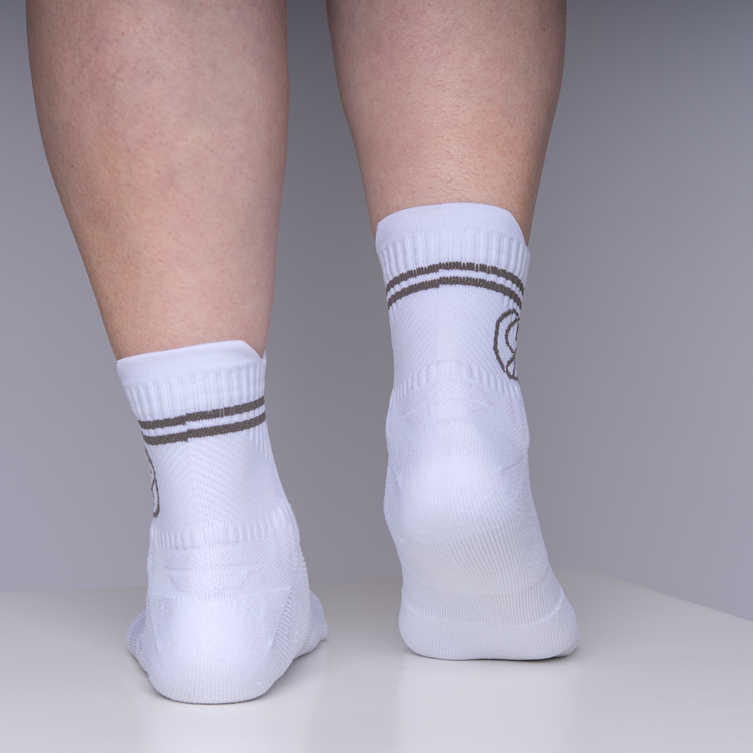 White socks with brown stripes on a neutral background