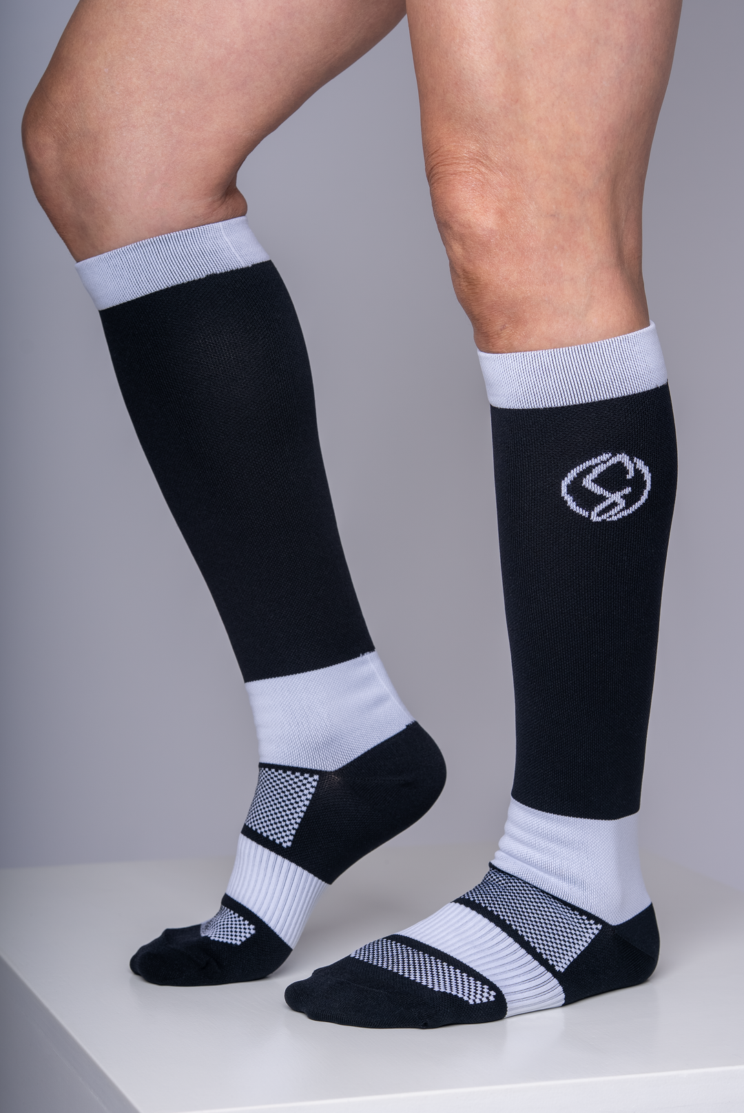 Black and white knee-high compression socks 