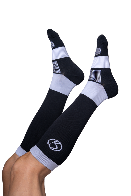 Black knee-high socks with white stripes and a logo on a white background