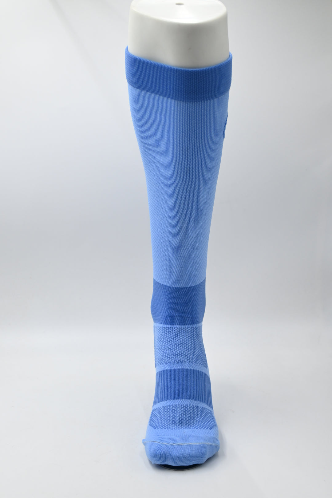 Blue knee-high sock on a white background